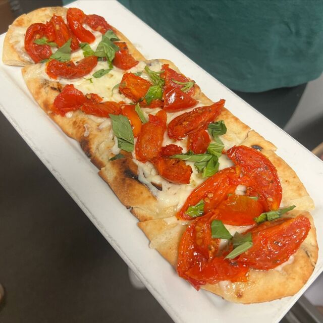 Our Patio Menu is out! The seasonal menu features bright new items including flatbreads, salads, sides and desserts!Featured above is our Roasted Tomato Flatbread with garlic oil, mozzarella & basil 🌿 Stop in and try something new!
